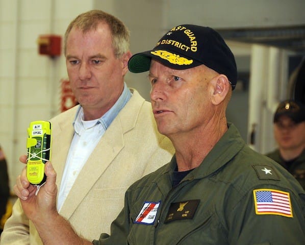 U.S. Coast Guard personnel with EPIRB device